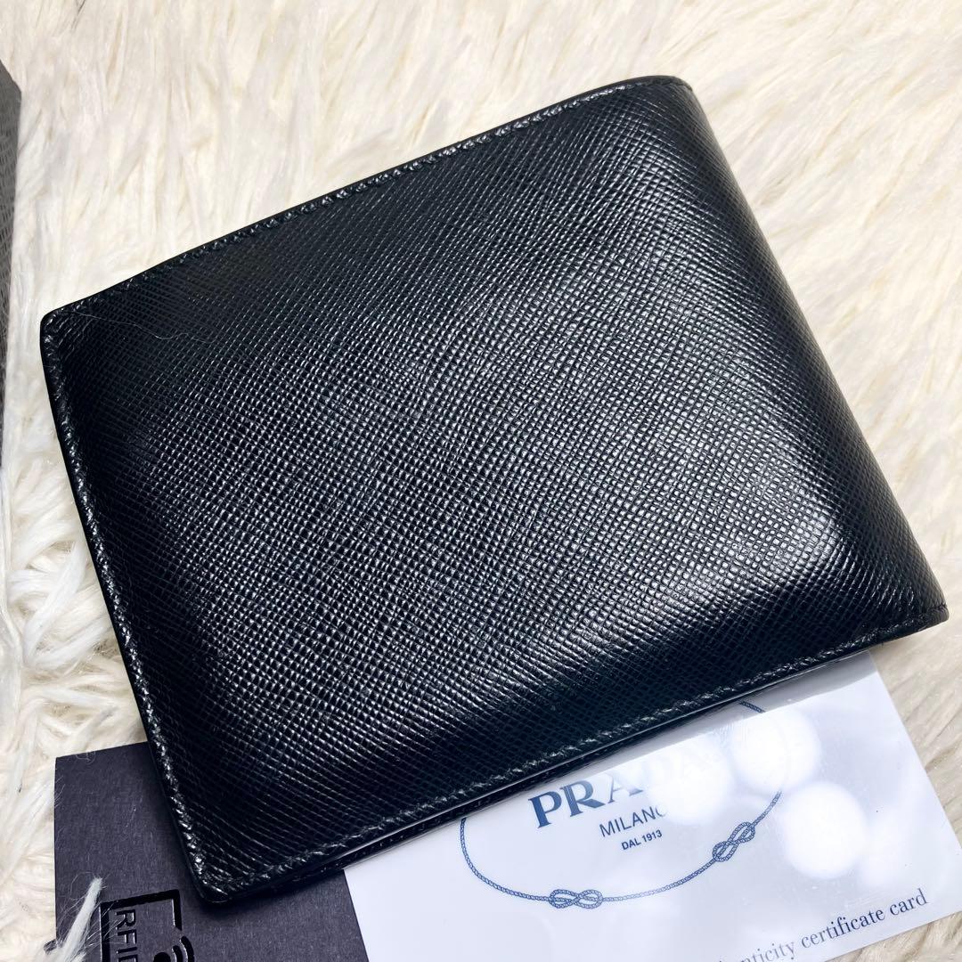 良品 PRADA 二つ折り財布 サフィアーノ メタルロゴ IC内蔵 - メルカリ